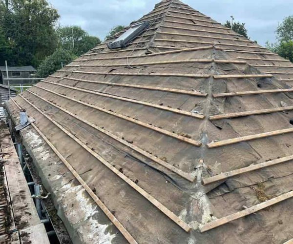 This is a photo of a hip roof that has been stripped back to the battens, and is awaiting a new roof covering to be installed. Works carried out by SAR Roofing Biggleswade